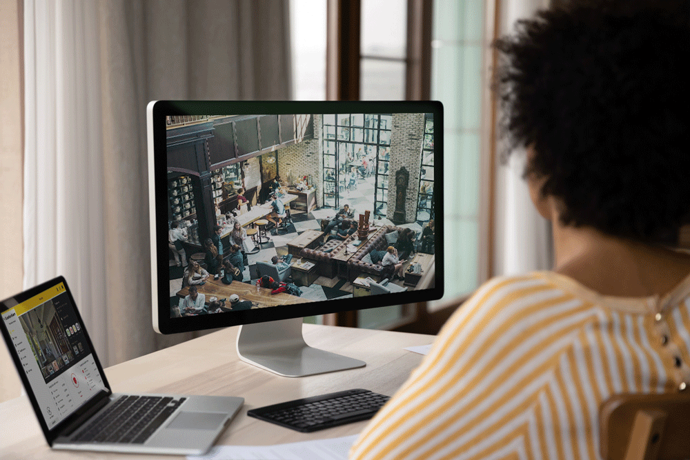 Boss watching coffee shop from Guardian Alarm App